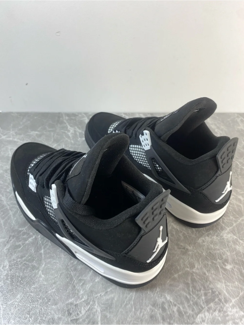 Jordan Black and White Low-Top Retro Sneakers